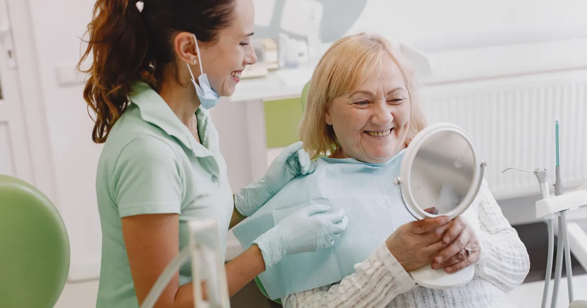 Dental bonding patient checking smile in China - QGO Medical